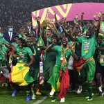 Senegal's players celebrate with the trophy after beating Egypt to win their first-ever Africa Cup of Nations Title on February 6 2022 | Senegal Celebrates Her First African Cup of Nations Victory